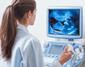 young woman doctor is viewing an ultrasound result to test for v